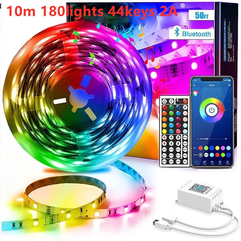 Bluetooth-controlled RGB LED light strip kit with remote on a 5-metre roll, showing UK plug adapter.