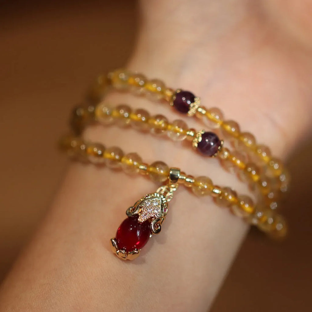 Natural Brazil gold rutilated quartz bracelet with three ring gold design and Chinese style manual crafted beads