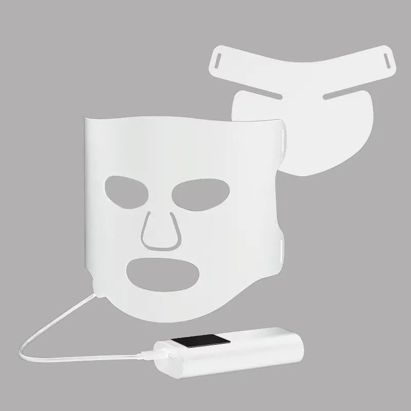 White and black LED phototherapy face mask with adjustable strap and controller for home skin light therapy