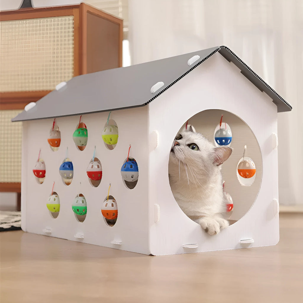Plastic house cat scratch board with integrated tunnel containing a bell ball toy