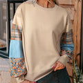 Women's loose fit long-sleeved top with beige and red plaid splicing pattern and pullover design