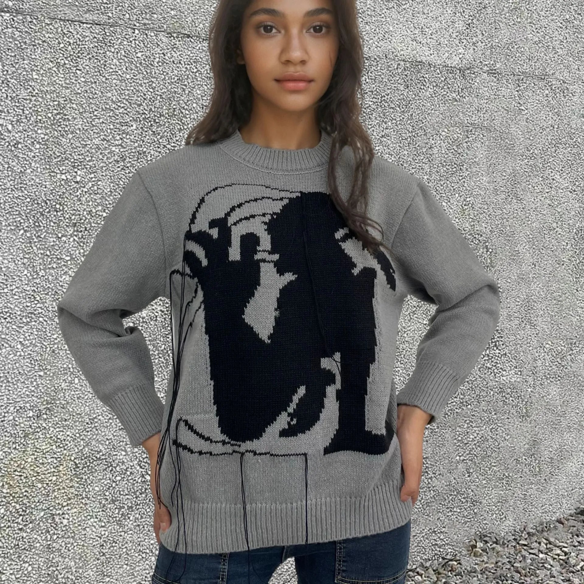 Grey women's alpaca wool sweater with abstract pattern and tassel design details