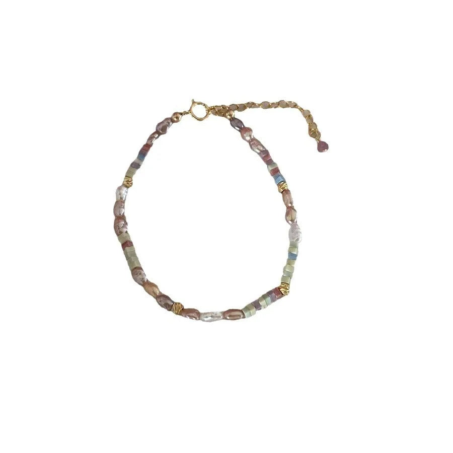 Women's natural pearl bracelet and necklace set with 14K gilded purple silver pieces and irregular U-shaped pearls.