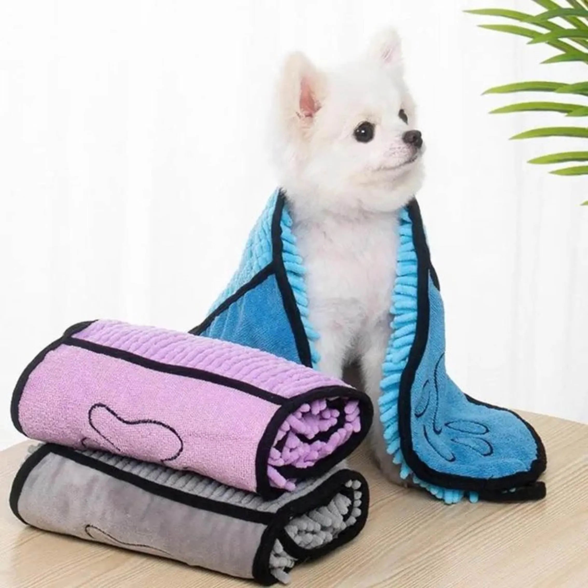 Blue dog bath towel with quick-dry absorbent fibre, measuring 62cm by 23cm.