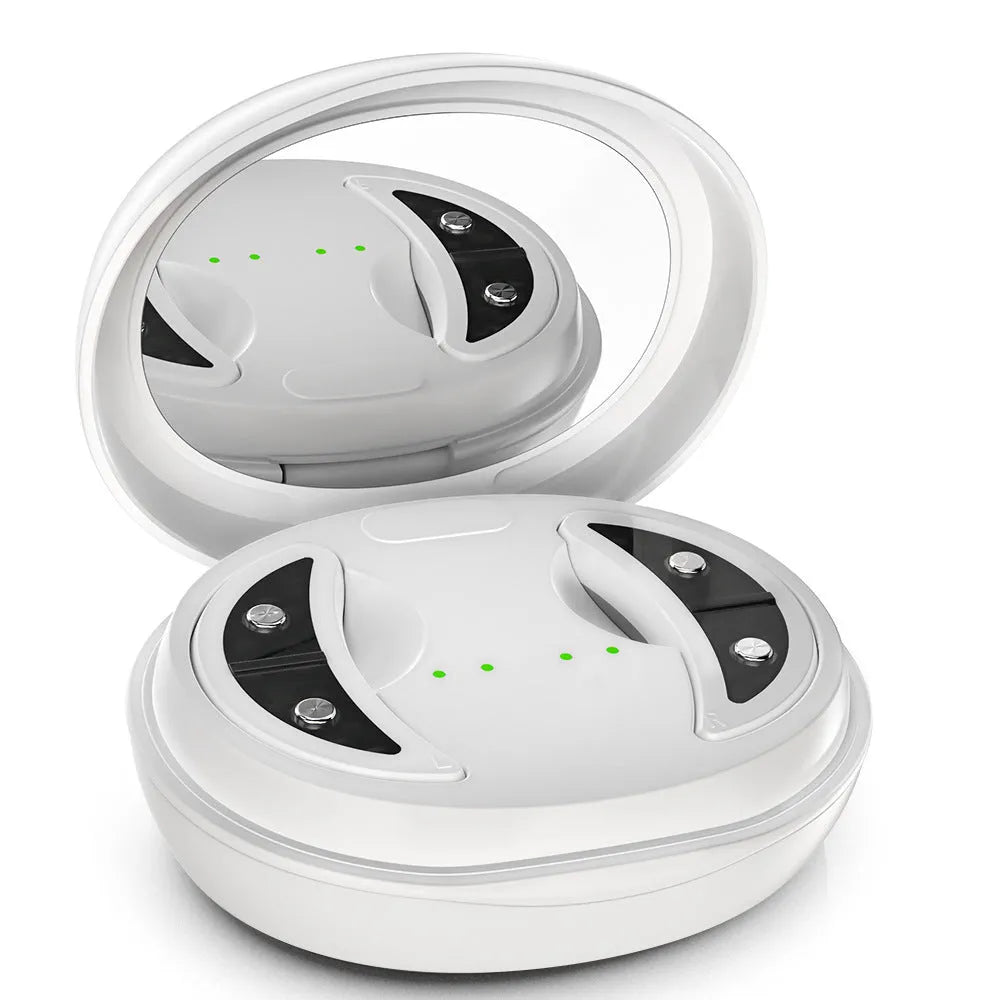 White wireless red light eye and facial massager with EMS technology held in hand