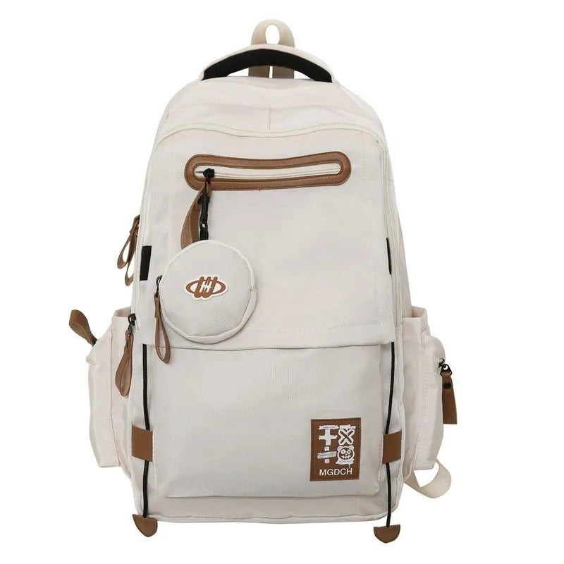 Large black nylon backpack for middle school students with curved shoulder straps.