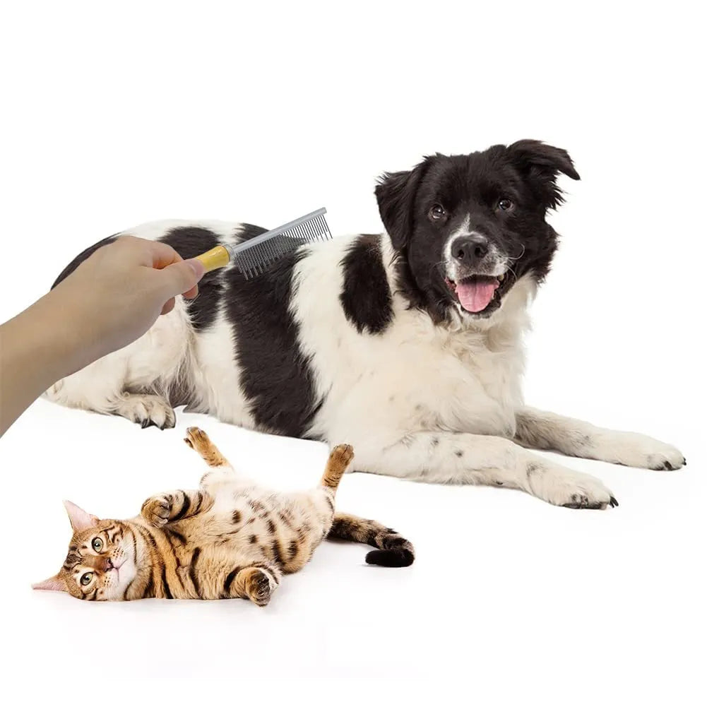 Wooden handle pet grooming comb for dogs and cats on a table.