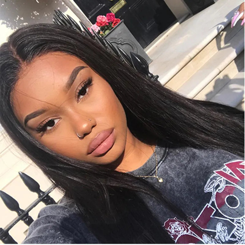 Long straight black wig with centre-parted bangs on wig stand