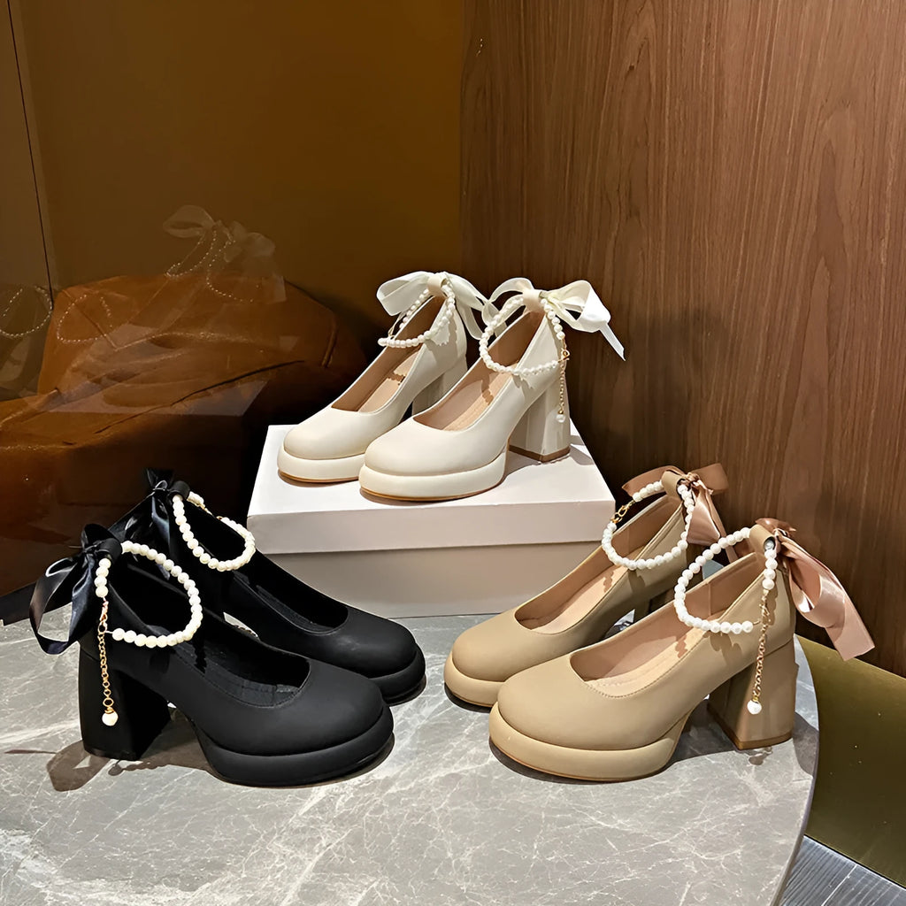 Women's beige Mary Jane shoes with a chunky heel and silver ankle-strap buckle on a round toe PU upper.