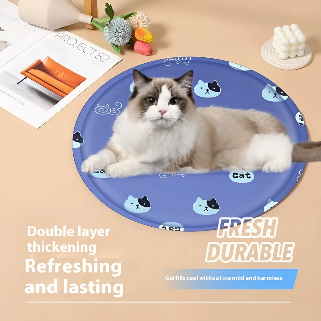 Round cartoon-themed dog cooling mat on a floor, showing gel-filled design and soft cloth cover.