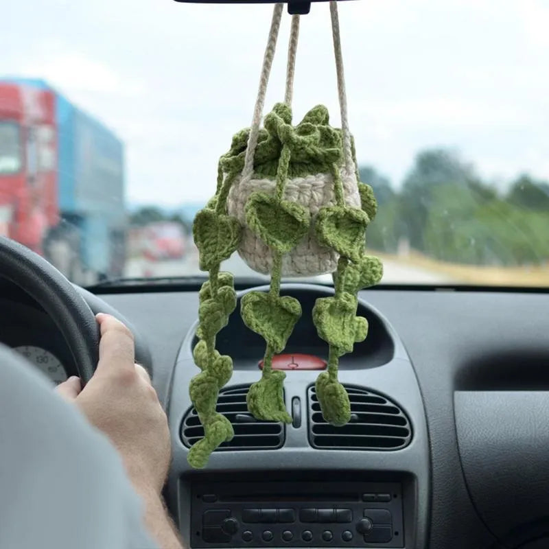 Knitted green and white car plant decoration with hanging rope