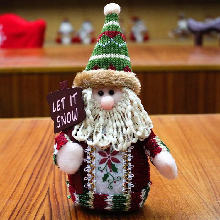 Red, green and white felt Christmas snowman decoration measuring 18 by 13 centimetres