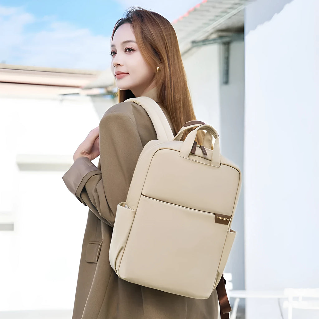 Women's canvas travel backpack in three sizes with multiple internal organisational compartments