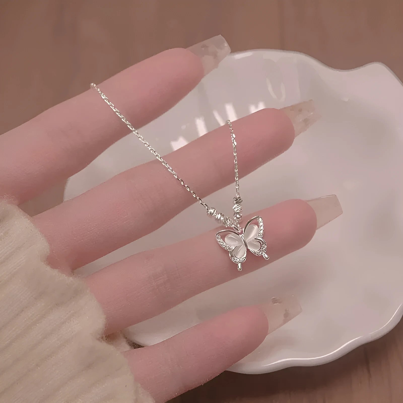 Women's silver butterfly necklace with square line pendant on cross chain