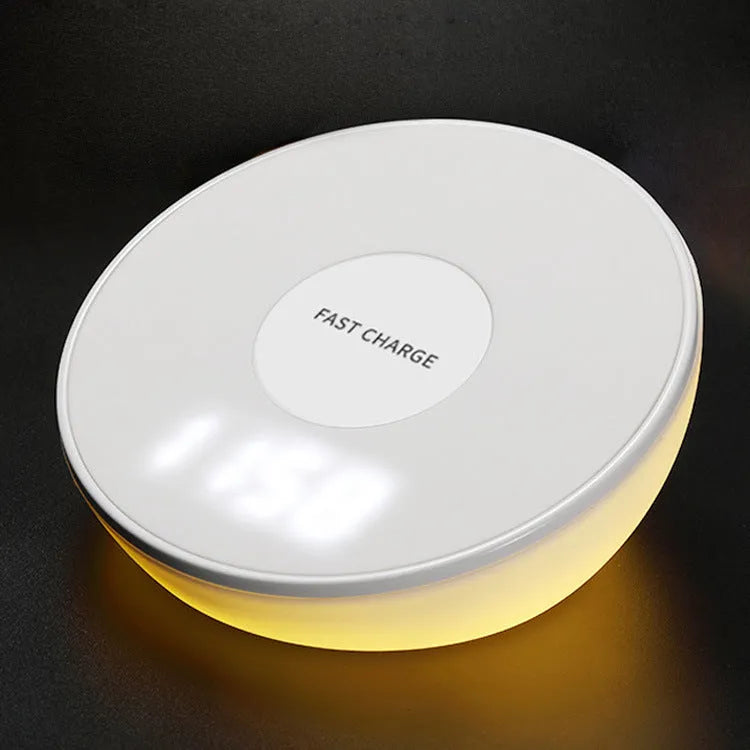 White rectangular wireless charging pad with a digital clock display on the front.