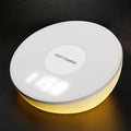 White rectangular wireless charging pad with a digital clock display on the front.
