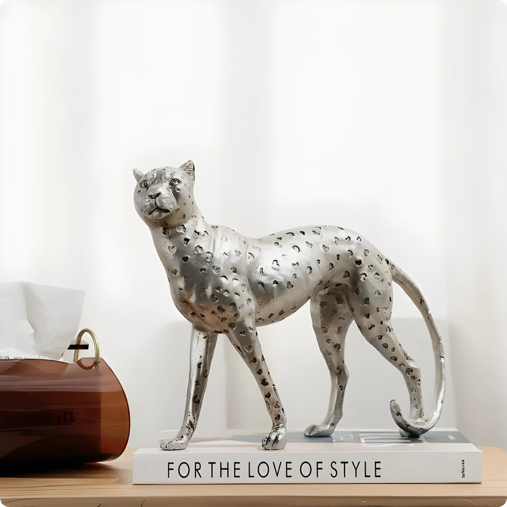 Modern resin leopard ornament in American Leopard colour on a shelf.