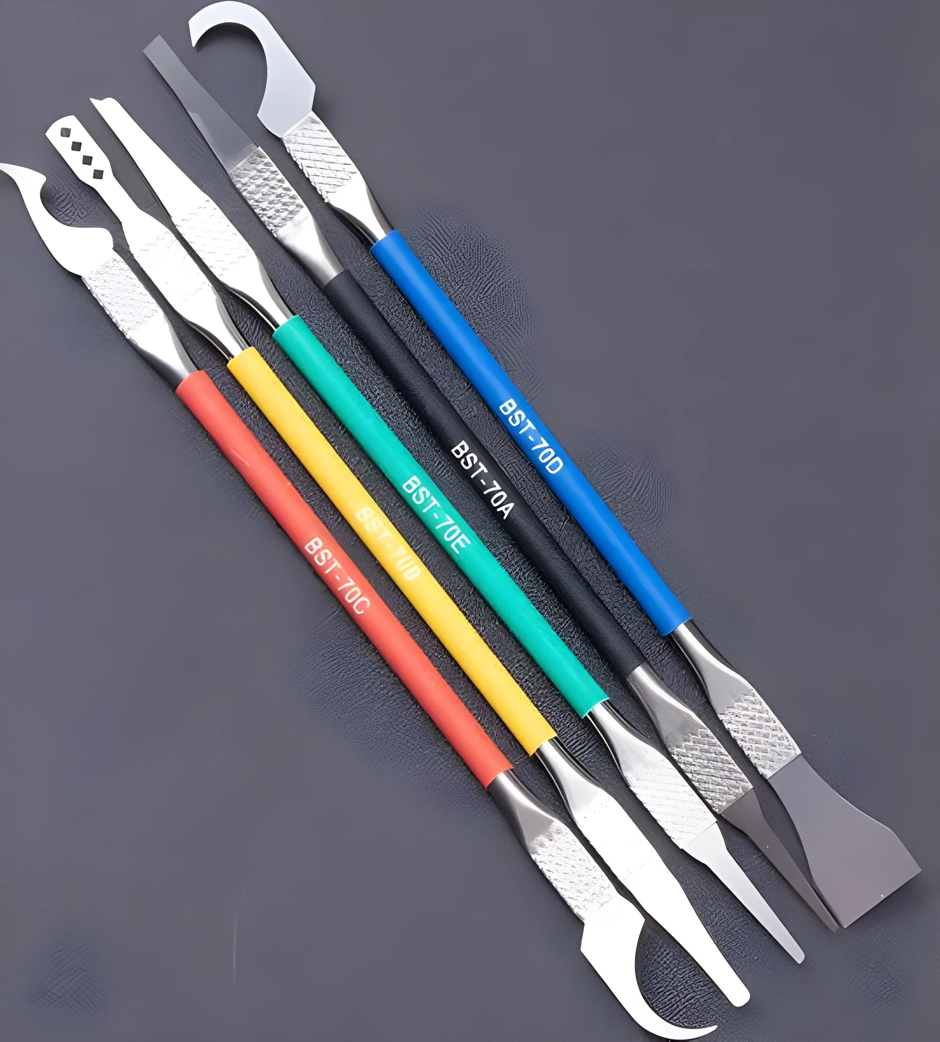 Five stainless steel disassembly crowbar tools with thin blades for plastic removal.