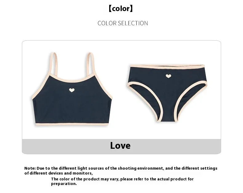 Dark blue split colour baby girls' swim briefs made from polyester and Lycra fabric.