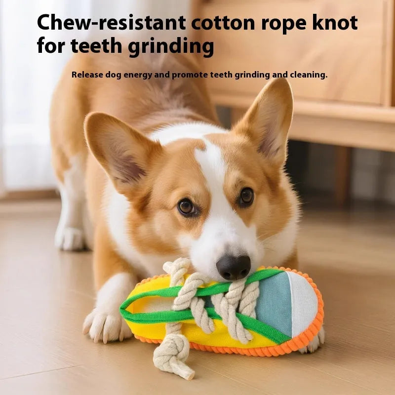 Slipper-shaped plastic dog chew toy in three colours with bends for chewing