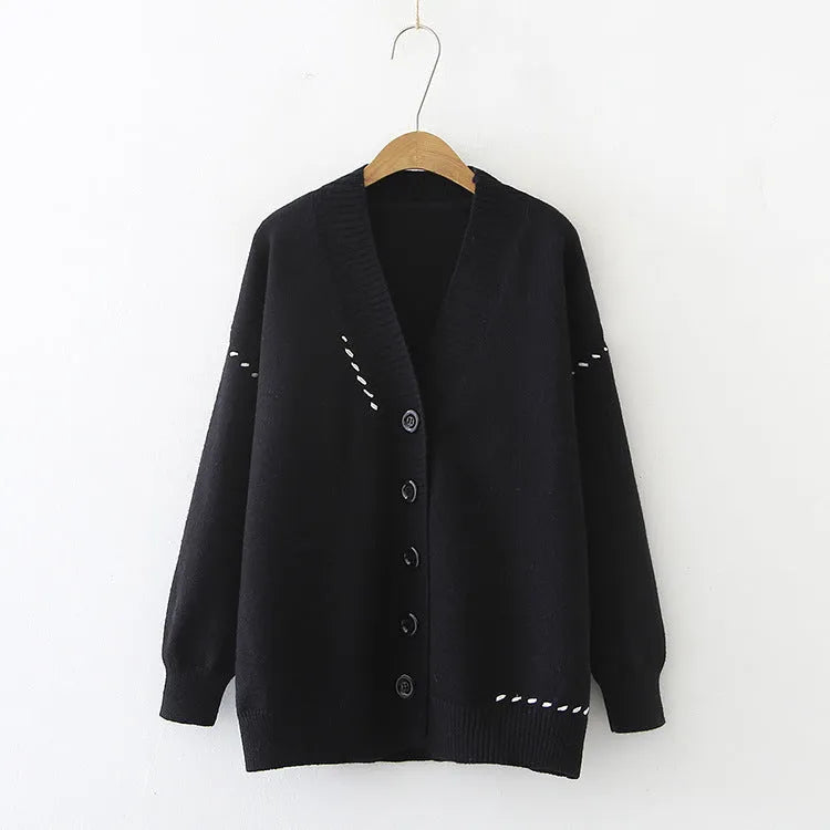 Women's long sleeve loose fit knitted cardigan coat in solid black or white colour.