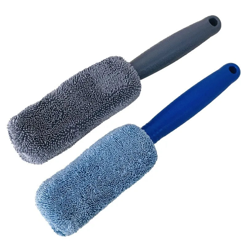 Blue long-handled microfiber brush for cleaning car tyres and wheels on a grey background.