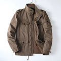 Men's loose fit cotton zip-up jacket in light brown shown on a model.