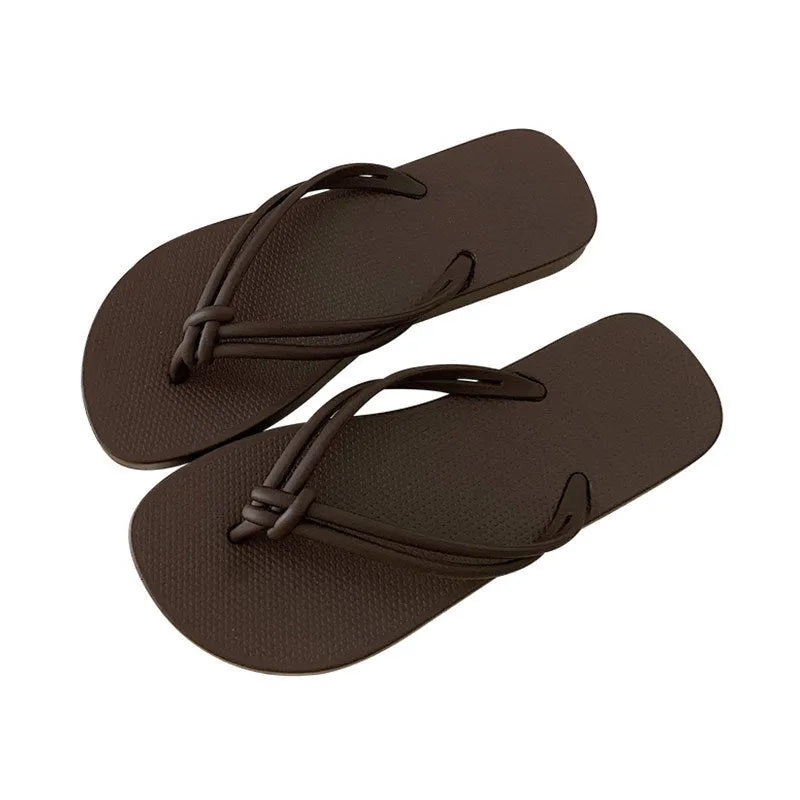 Men's casual flip flops with toe covering in PVC material, showing non-slip sole pattern and full foot enclosure design