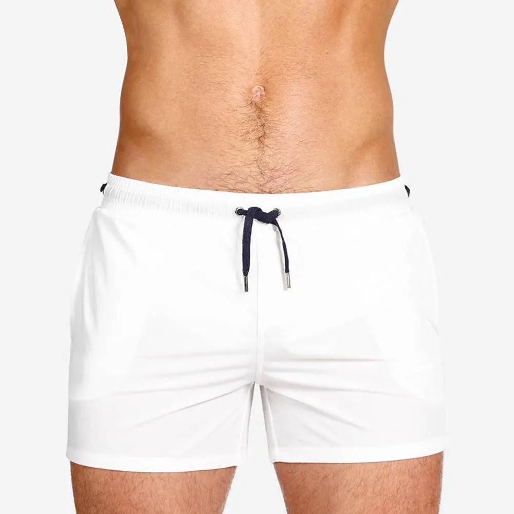 Mesh-lined sports shorts in polyester fabric with elastic waistband available in multiple colours