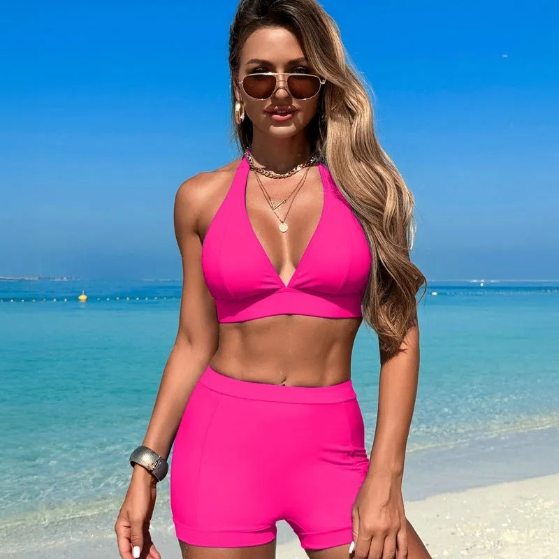 Women's split bikini swimsuit in black, pink, blue, or purple with sleeveless design for swimming