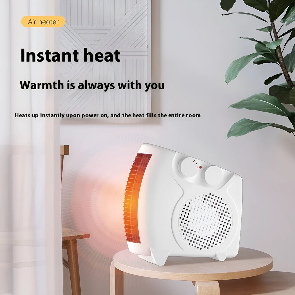 Small white desktop electric heater with control dial and grille, shown from the front.