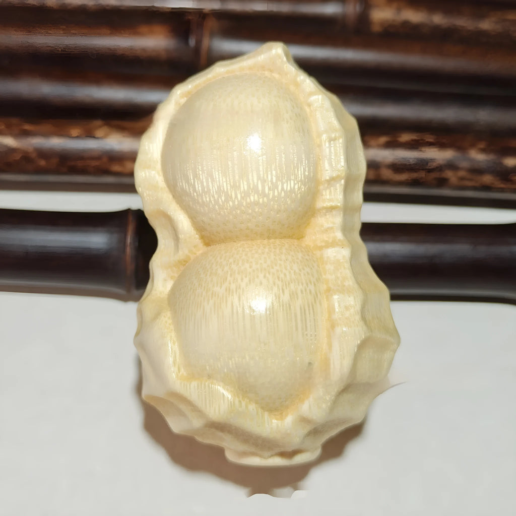 Solid natural bamboo peanut ornament with 'good things may happen' engraved message.