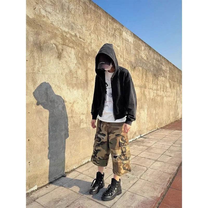 Men's straight-leg cropped jeans in camouflage pattern with patchwork detailing and distressed rips
