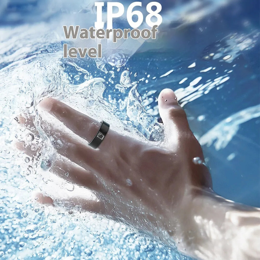 Black ceramic smart ring for heart rate and blood oxygen monitoring on a finger.
