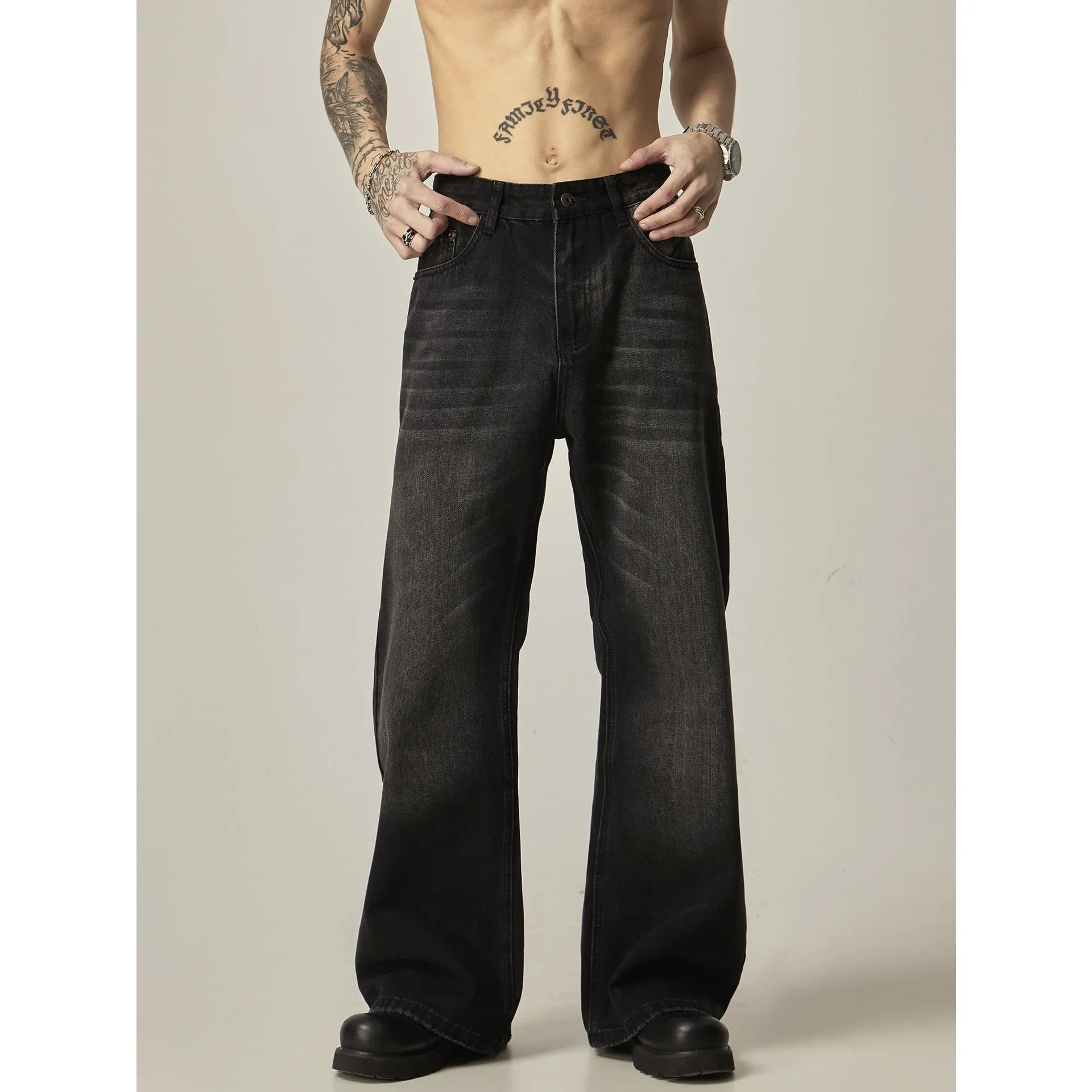 Black loose straight-leg jeans with retro styling and zipper fly