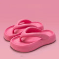 Solid colour EVA flip-flops with thick sole and decorative bow.