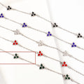 Women's geometric stainless steel bracelet with triple diamond design and coloured stone in gold or steel tone.