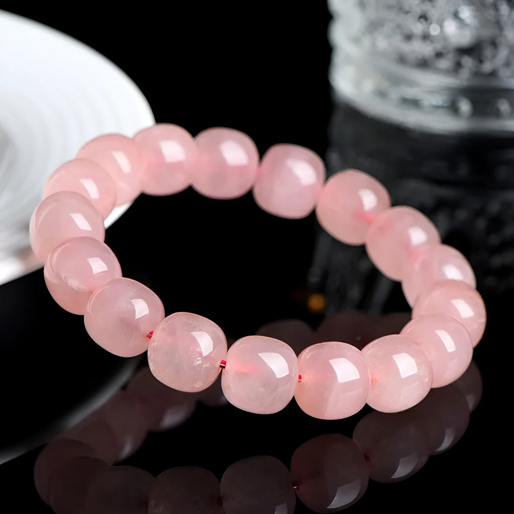 Natural pink crystal barrel bead bracelet with geometric 8x10mm beads