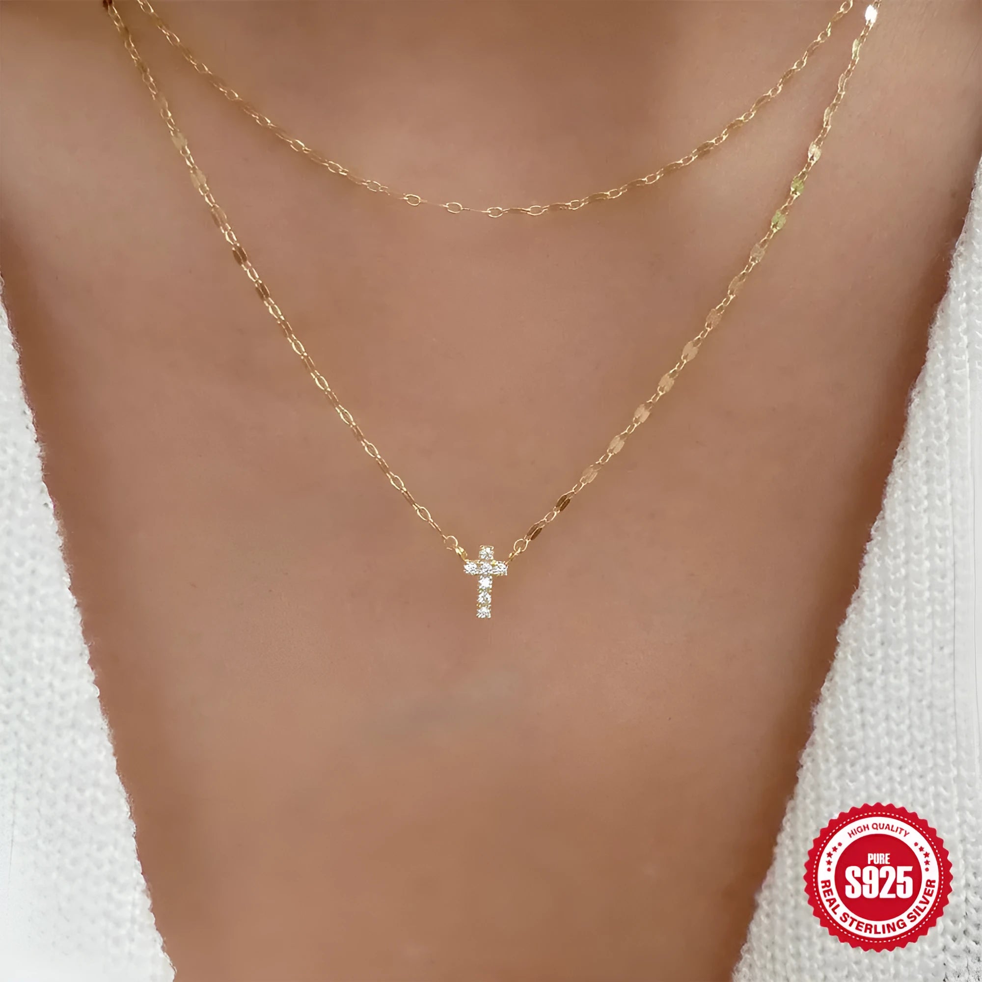 Sterling silver geometric cross pendant necklace with double layer design and diamond detailing on clavicle chain