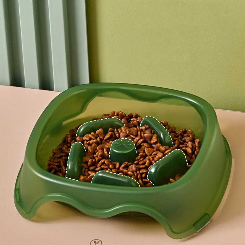 Blue plastic dog slow feeder bowl with anti-choking design on a white background.