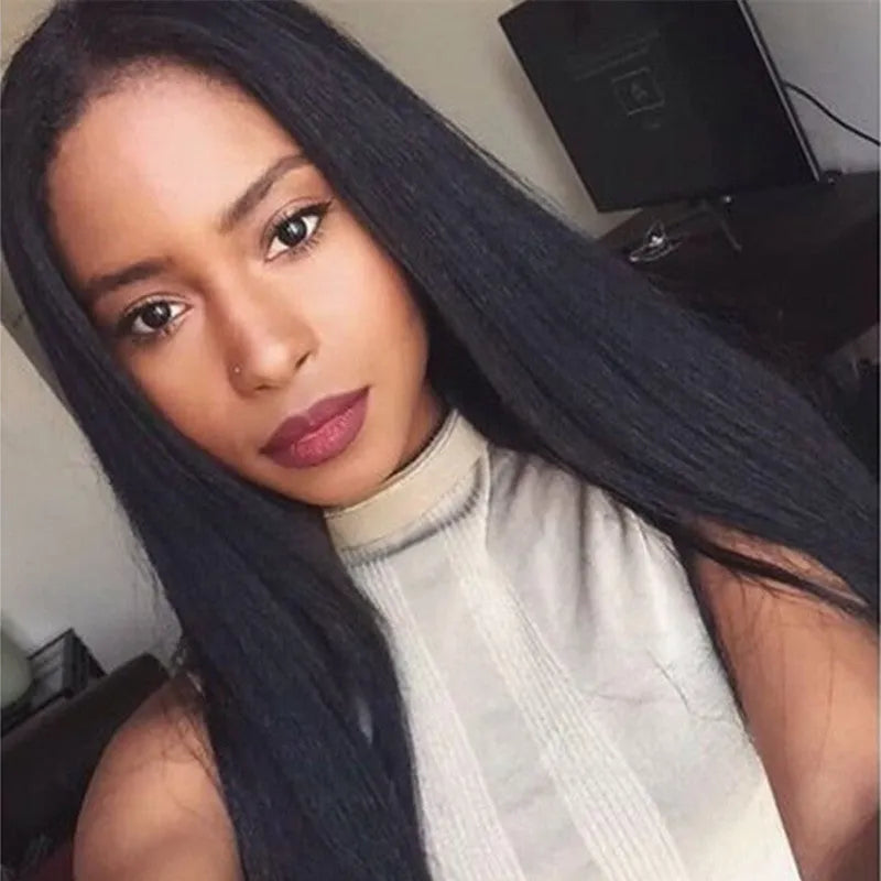 Long straight black wig with centre-parted bangs on wig stand