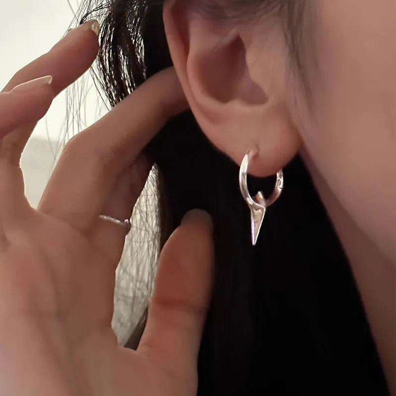 Geometric star-shaped ear clips with electroplated platinum finish on copper construction