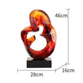 Transparent resin ornament in modern style available in blue or orange red colour
