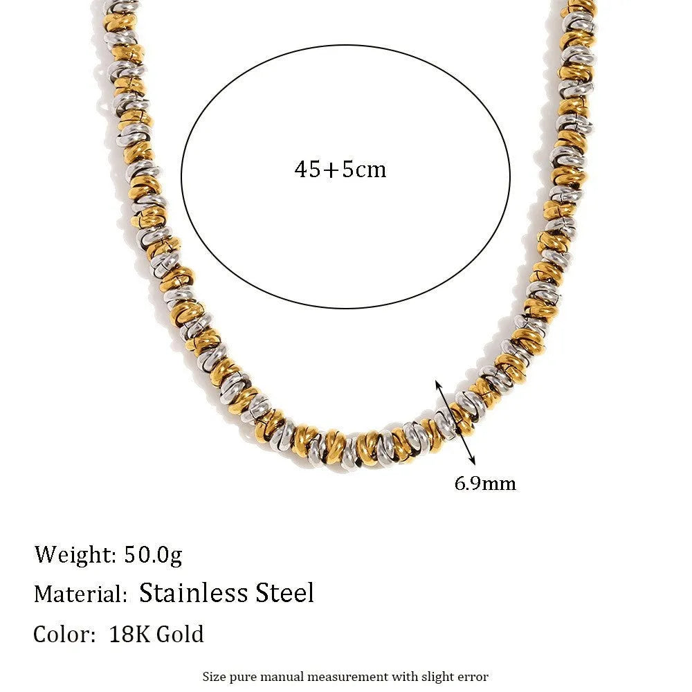 Gold electroplated stainless steel jewellery set comprising geometric earrings, bracelet and necklace.
