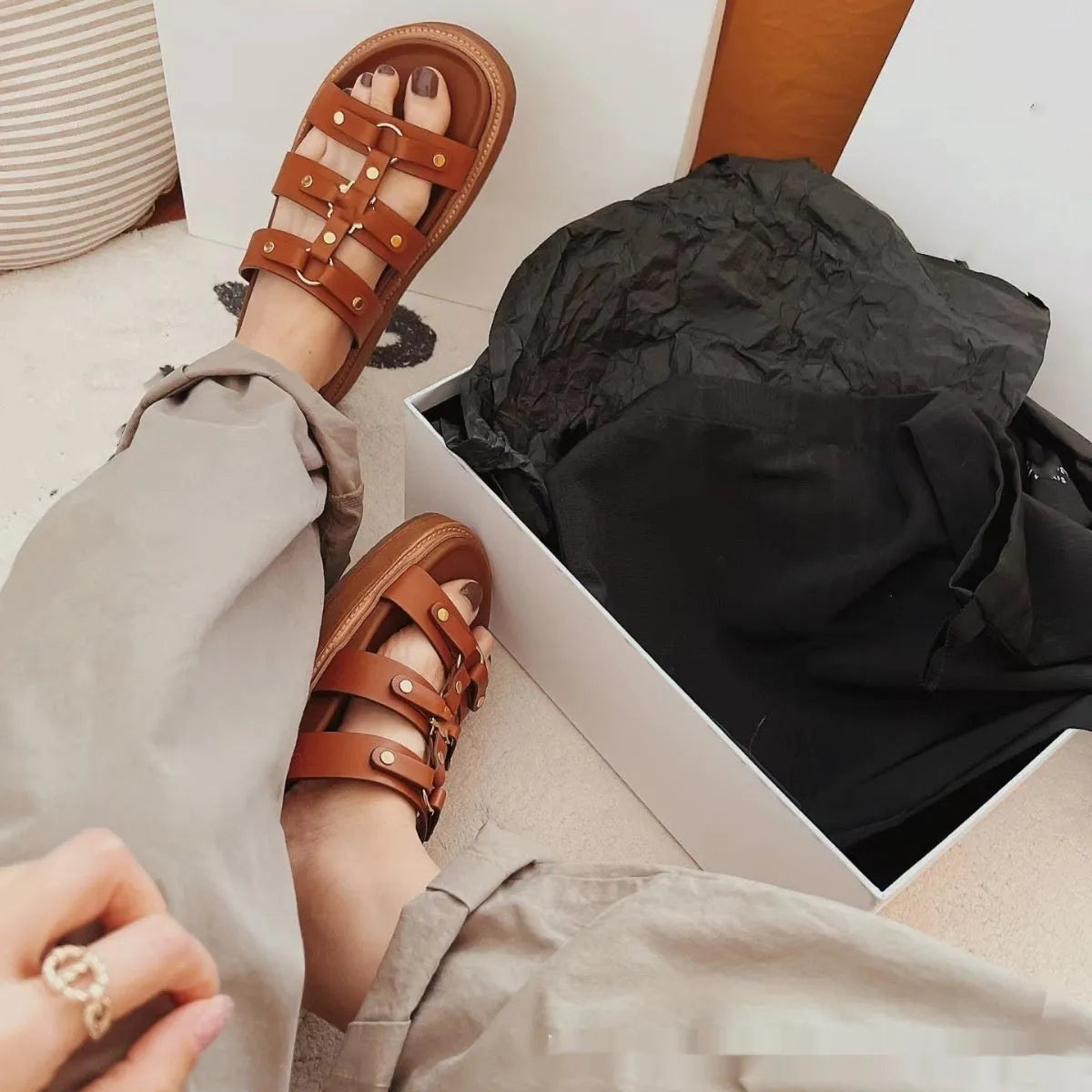 Women's retro Roman style sandal slippers in patent leather finish with adjustable ankle straps.