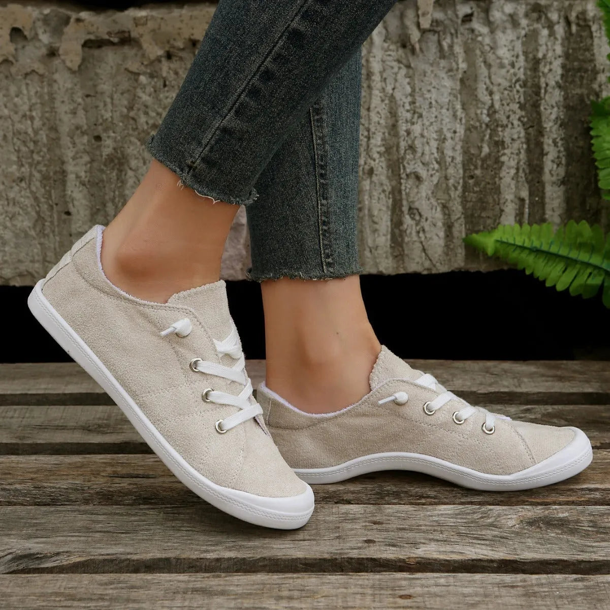 Women's creamy-white beige low-top fabric casual sneakers on a wear-resistant rubber sole.