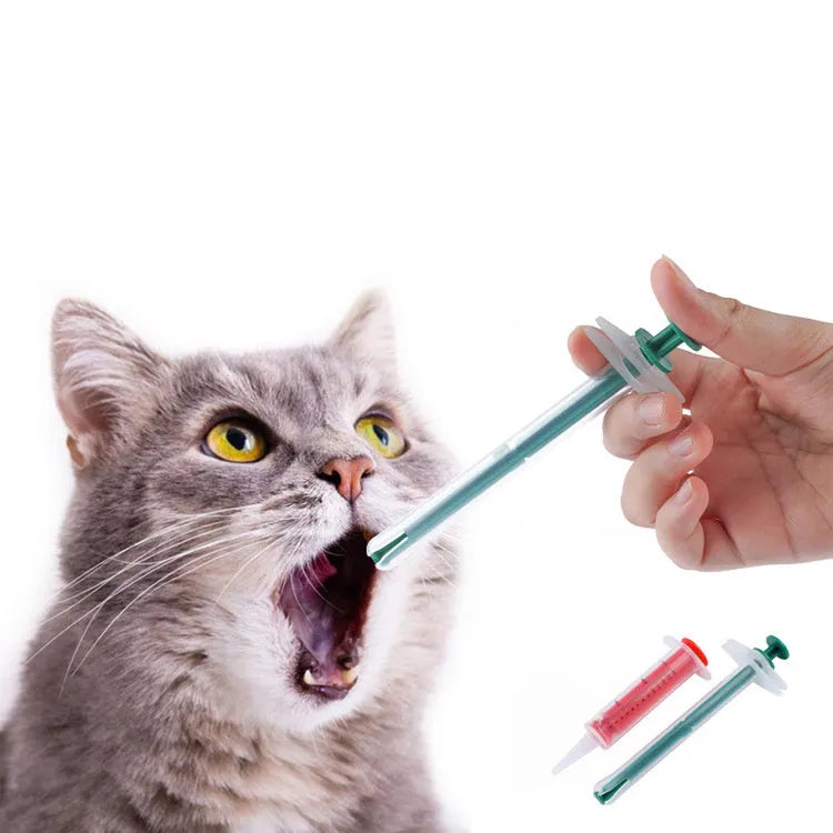 Two silicone pet pill shooter syringes with soft tips on a white background