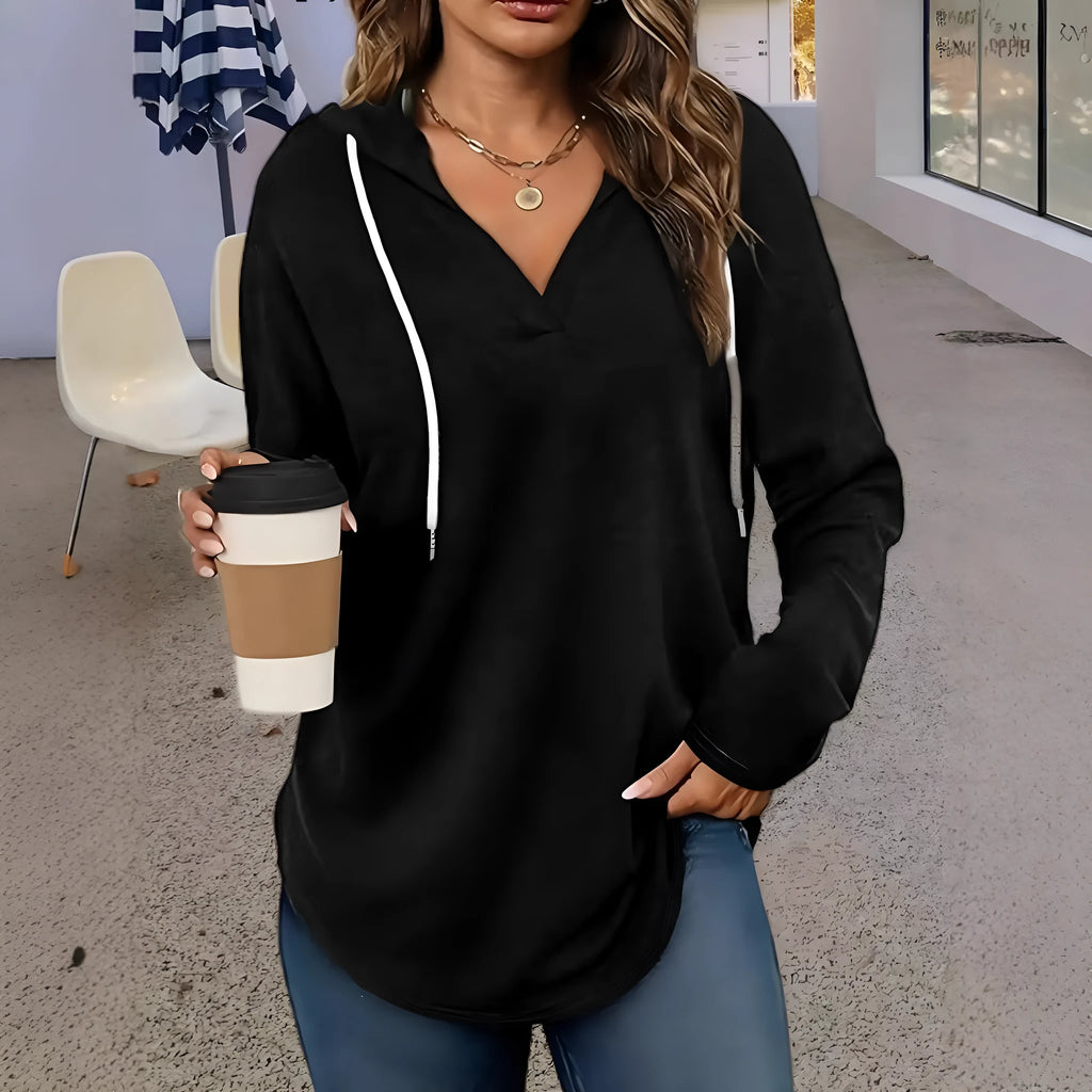 Red women's V-neck hooded sweatshirt with long sleeves on a hanger.