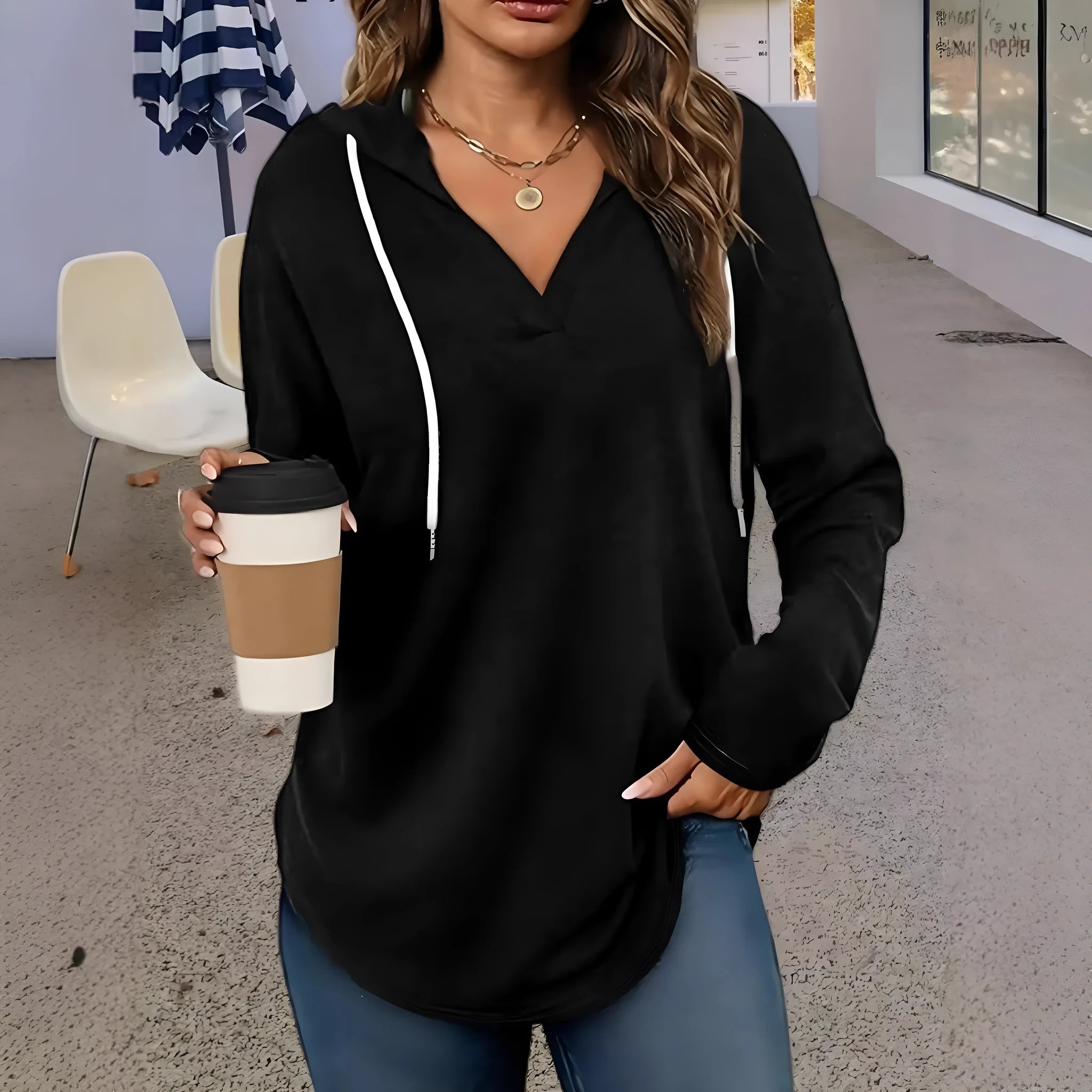 Red women's V-neck hooded sweatshirt with long sleeves on a hanger.