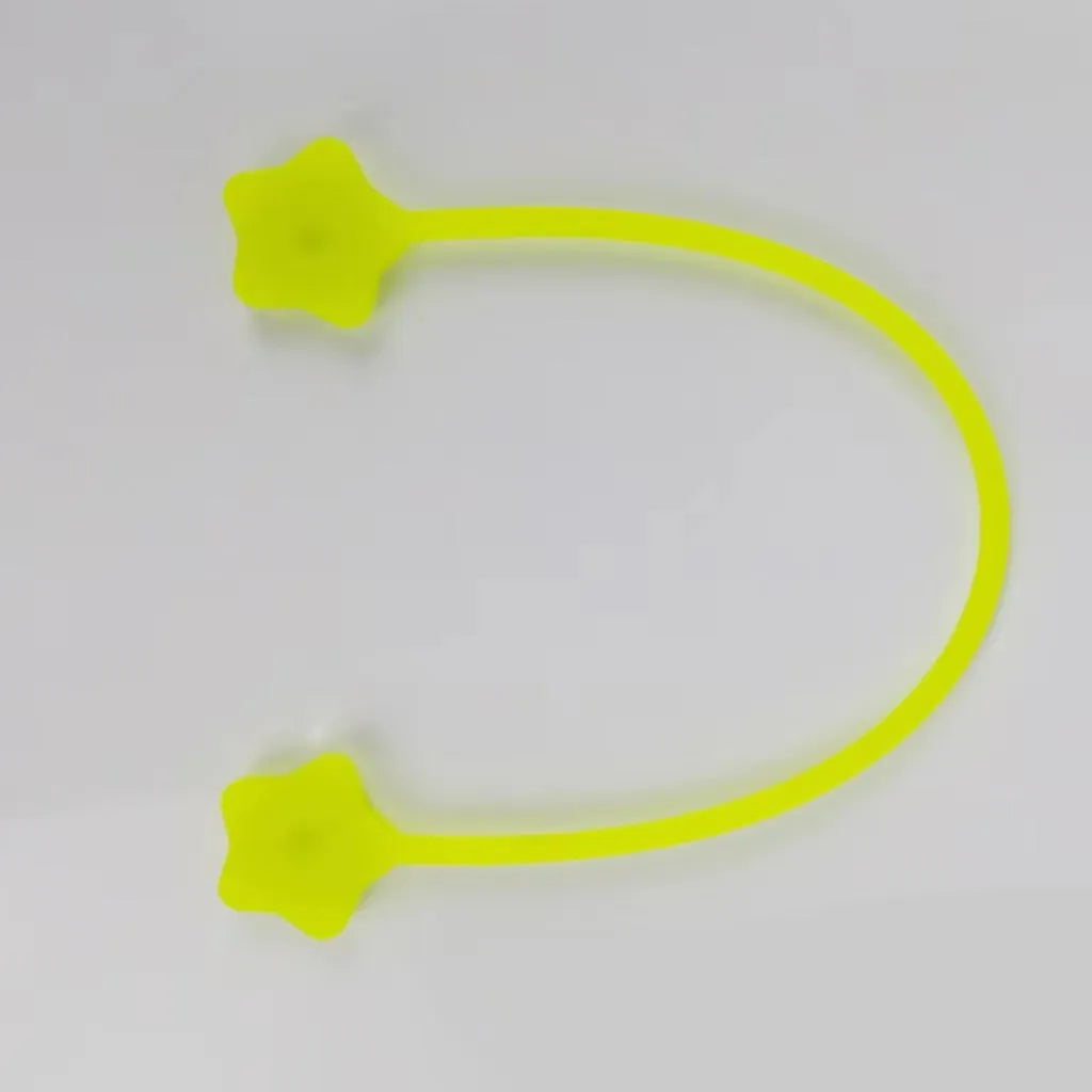 Purple silicone wire winder with magnet for organising headphone and computer cables.